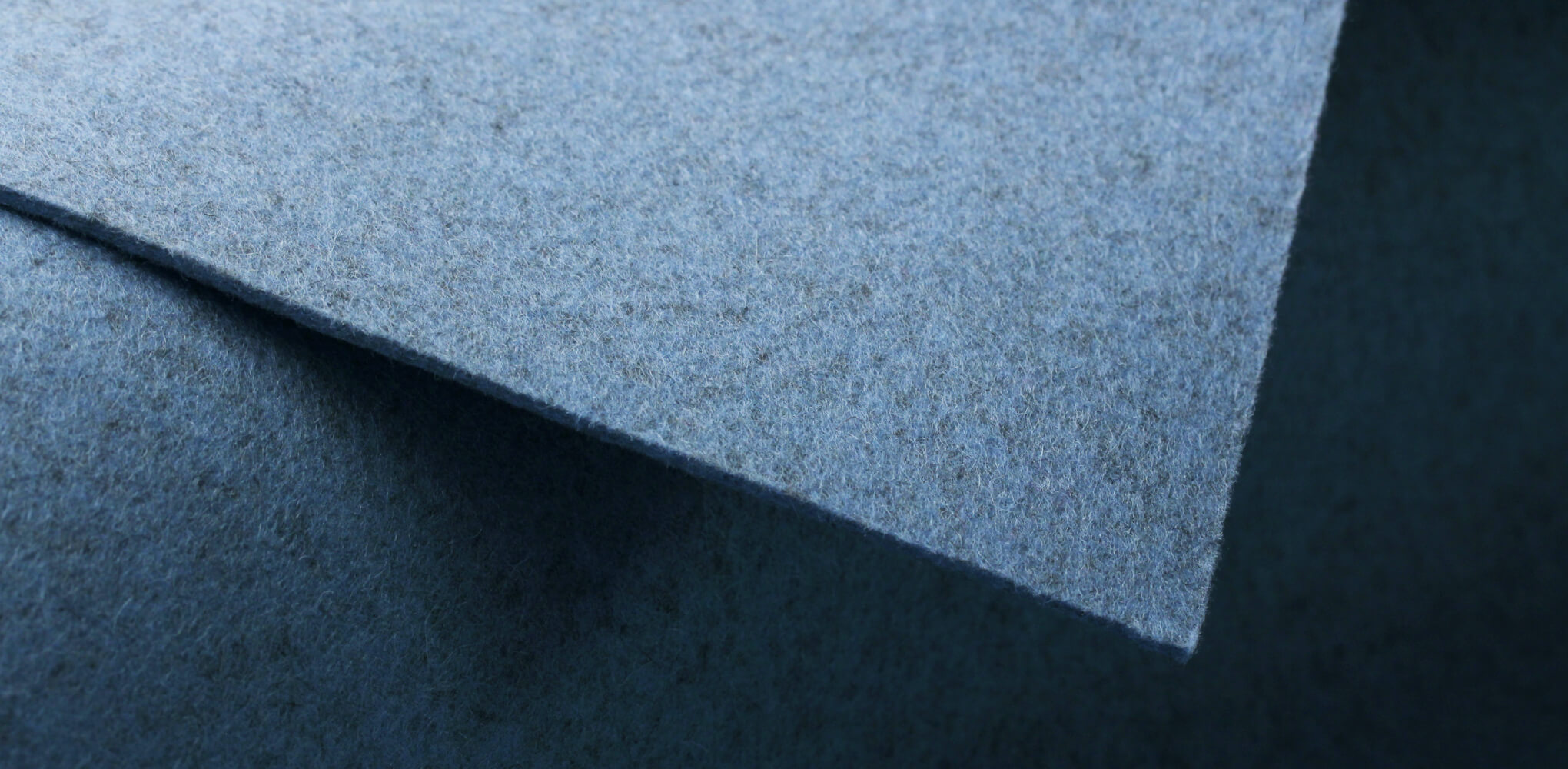 Macro photo of light blue wool felt